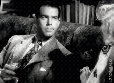 Man in Suit and Tie Sitting on Couch