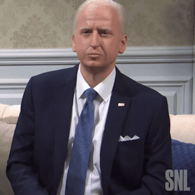 Man in Suit and Tie Sitting on Couch