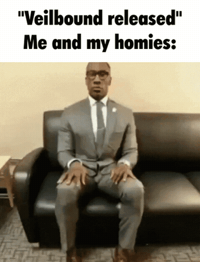 Man In Suit And Tie Sitting On Couch Saying Veilbound Released Me And My Homies GIF