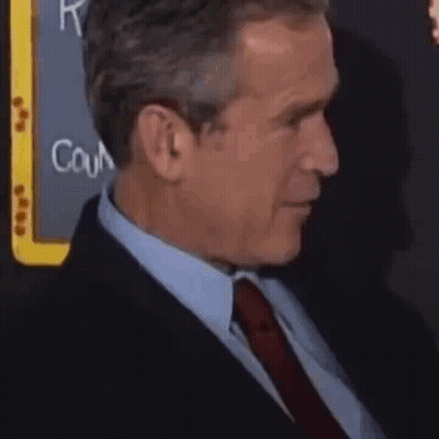 Man In Suit And Tie Sitting GIF