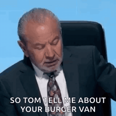 Man In Suit And Tie Sitting With Eyes Closed GIF