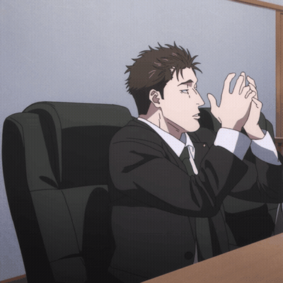 Man In Suit And Tie Sitting With Hands Folded GIF