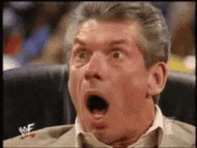 Man In Suit And Tie Sitting With Open Mouth GIF