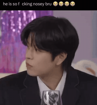 Man In Suit And Tie Sitting With Wine Glass GIF