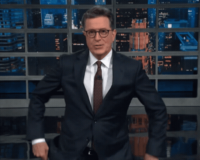 Man In Suit And Tie Smiling And Dancing GIF