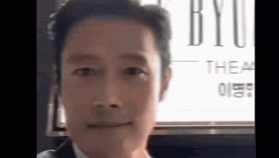 Man In Suit And Tie Smiling At Camera GIF
