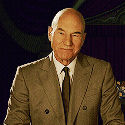 Man In Suit And Tie Smiling At Camera GIF