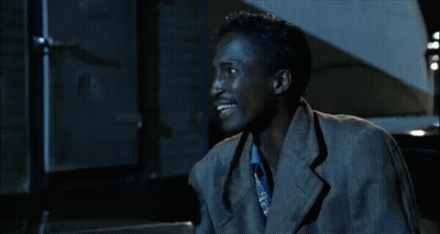 Man In Suit And Tie Smiling At Table With Woman GIF