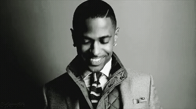 Man In Suit And Tie Smiling Black And White GIF