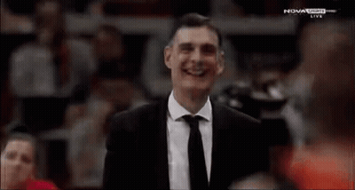 Man In Suit And Tie Smiling Nova Sports Game GIF