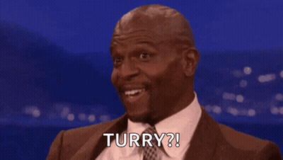 Man In Suit And Tie Smiling Says Turry GIF