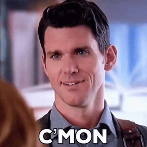 Man In Suit And Tie Smiling While Talking To Woman GIF