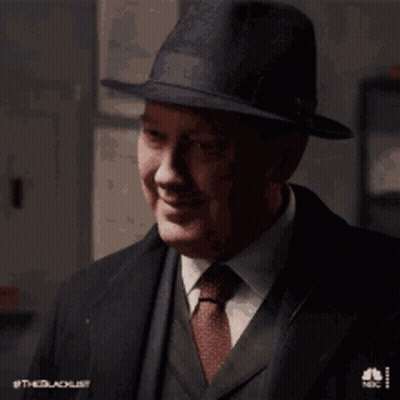 Man In Suit And Tie Smiling With Hat GIF