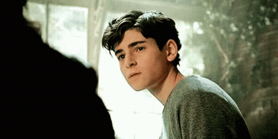 Man In Suit And Tie Smiling With Other Men GIF