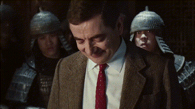 Man In Suit And Tie Smiling With Soldiers GIF