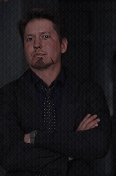 Man In Suit And Tie Smoking Cigar GIF