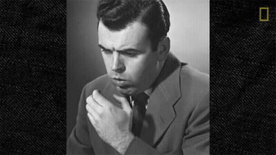 Man In Suit And Tie Smoking Cigarette Black And White GIF