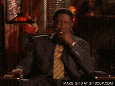 Man In Suit And Tie Smoking Cigarette GIF