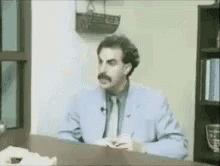 Man in Suit and Tie Speaking