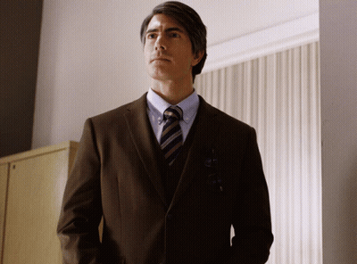 Man In Suit And Tie Standing GIF
