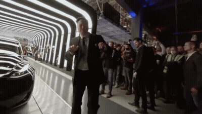 Man In Suit And Tie Standing Before Crowd GIF