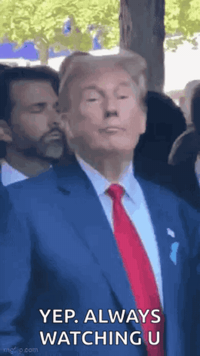 Man In Suit And Tie Standing Before Crowd GIF