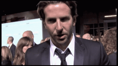 Man In Suit And Tie Standing Before Crowd GIF