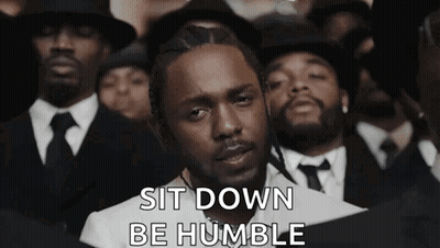 Man In Suit And Tie Standing Before Crowd GIF