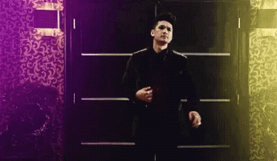 Man In Suit And Tie Standing Before Door GIF