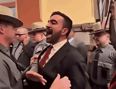Man In Suit And Tie Standing Before Police Officers GIF