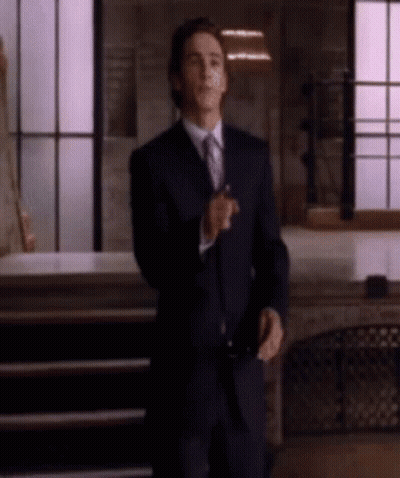 Man In Suit And Tie Standing GIF