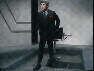 Man In Suit And Tie Standing GIF