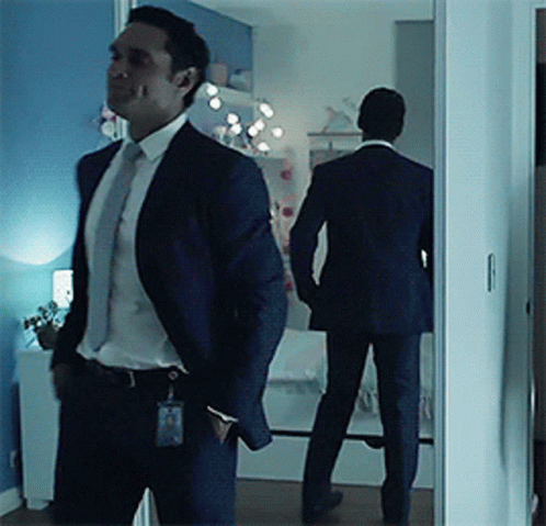 Man In Suit And Tie Standing GIF