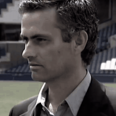 Man In Suit And Tie Standing In Field GIF