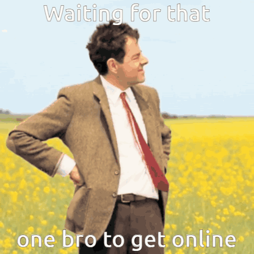 Man In Suit And Tie Standing In Field Of Yellow Flowers GIF