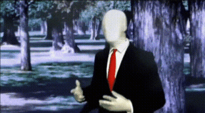 Man in Suit and Tie Standing in Forest