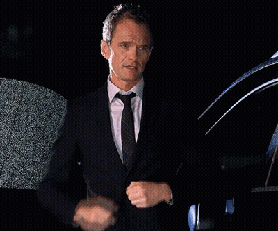 Man In Suit And Tie Standing In Front Of Black Car GIF