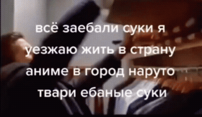 Man In Suit And Tie Standing In Front Of Closet GIF