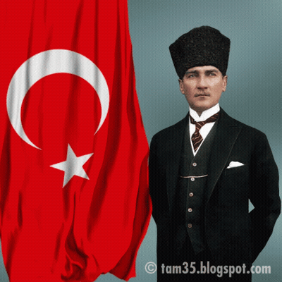 Man In Suit And Tie Standing In Front Of Flag GIF