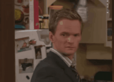 Man In Suit And Tie Standing In Front Of Fridge GIF