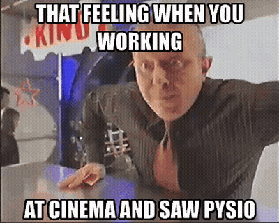 Man In Suit And Tie Standing In Front Of Kind Sign GIF