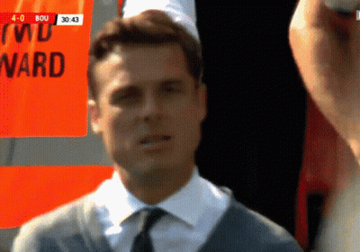 Man In Suit And Tie Standing In Front Of Ward Sign GIF