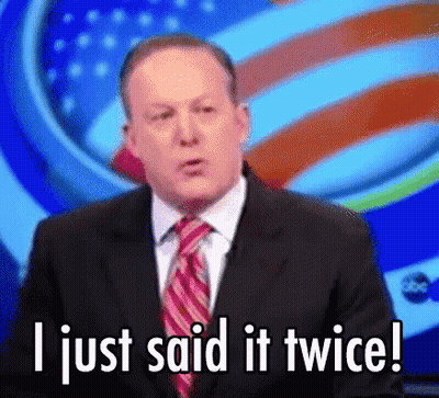 Man In Suit And Tie Standing In Living Room GIF