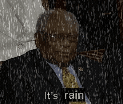 Man In Suit And Tie Standing In Rain Saying It's Raining GIF