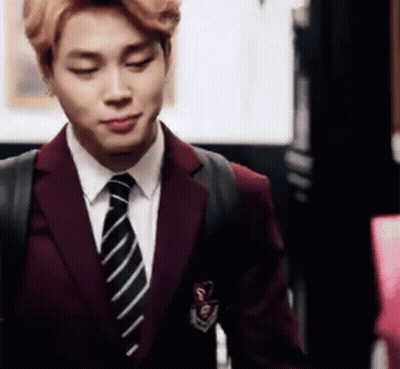 Man In Suit And Tie Standing In Room GIF