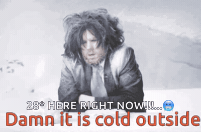 Man In Suit And Tie Standing In Snow GIF
