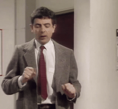 Man In Suit And Tie Standing GIF