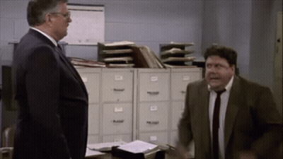 Man In Suit And Tie Standing Next To Another Man GIF