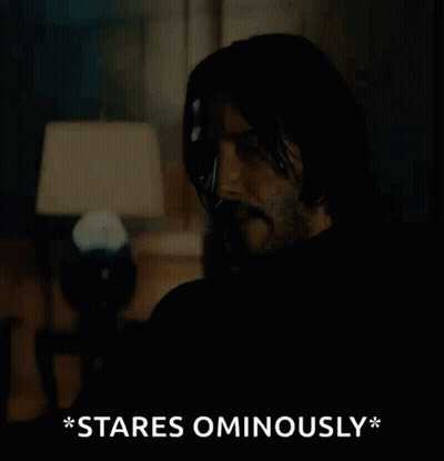 Man In Suit And Tie Staring Ominously GIF