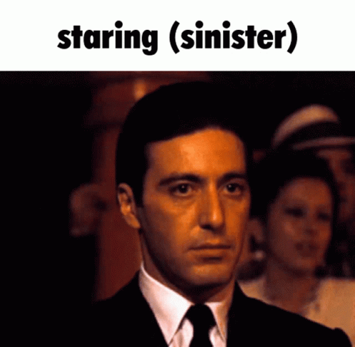 Man In Suit And Tie Staring (Siner) GIF